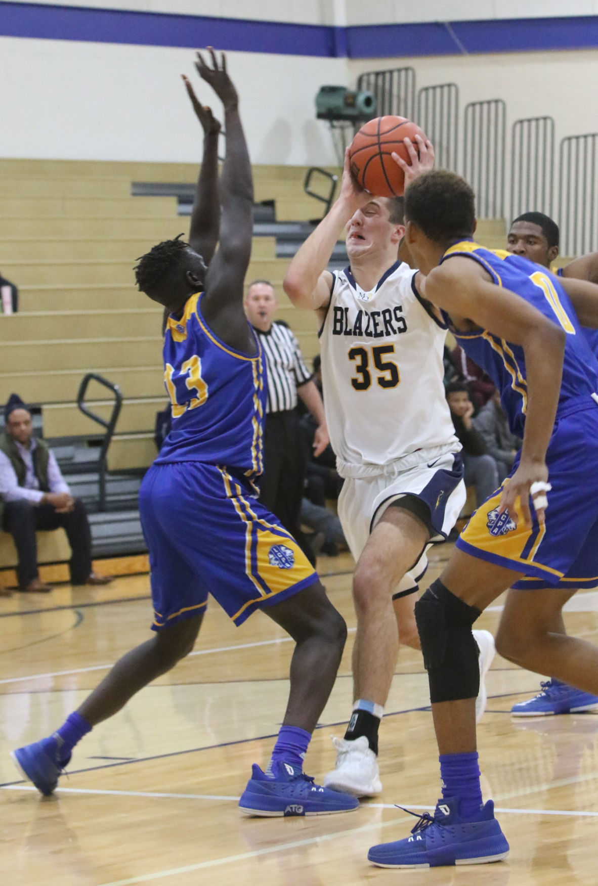 Lighthouse at Marquette Catholic boys basketball